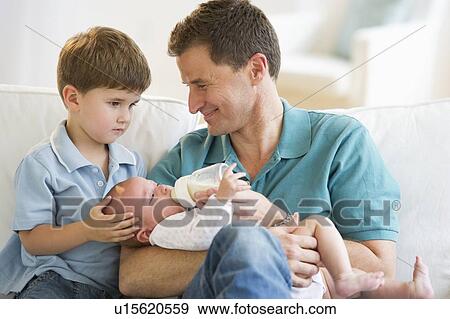 Stock Photo - Father and his two sons. Fotosearch