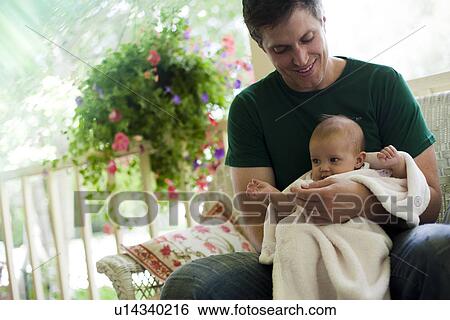 Father sitting on porch with his baby daughter View Large Photo Image Stock Photograph - Father sitting on porch with his baby daughter. Fotosearch
