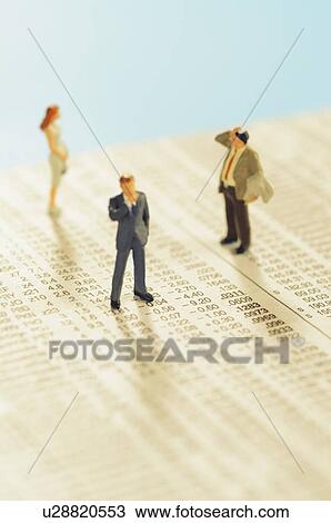 Stock Image - Figurines of people standing on stock chart. Fotosearch
