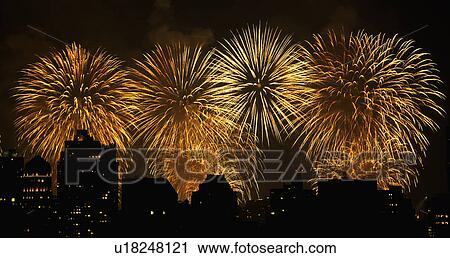 Stock Image - Fireworks over New York City skyline. Fotosearch