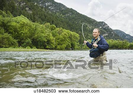 Stock Image - Fly fisherman. Fotosearch