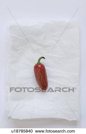 Stock Image - Fresno pepper on parchment paper. Fotosearch