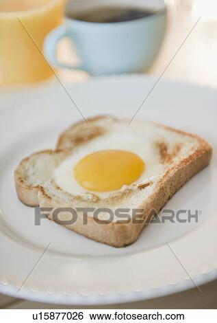 Fried egg on toast View Large Photo Image Stock Photograph - Fried egg on toast. Fotosearch