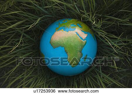 Stock Photograph - Globe in grass. Fotosearch