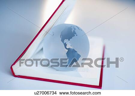 Globe inside a book View Large Photo Image Picture - Globe inside a book. Fotosearch