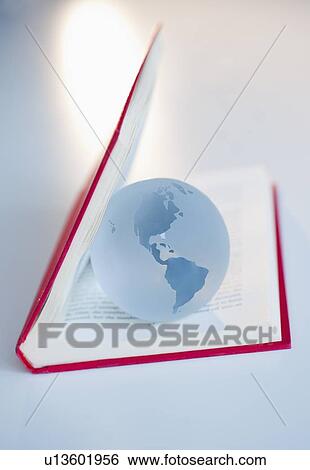 Stock Photograph - Globe inside a book. Fotosearch
