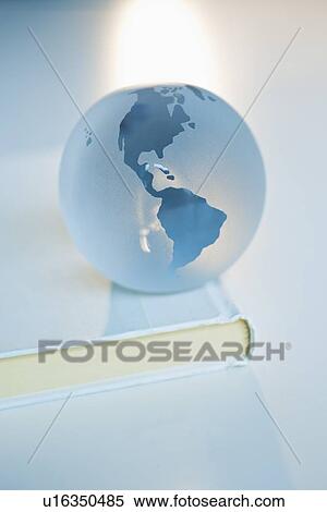 Globe on a book View Large Photo Image Stock Photography - Globe on a book. Fotosearch