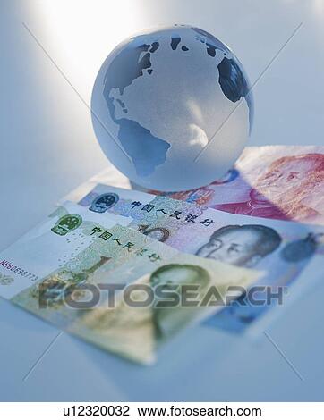 Globe on Chinese currency View Large Photo Image Stock Image - Globe on Chinese currency. Fotosearch