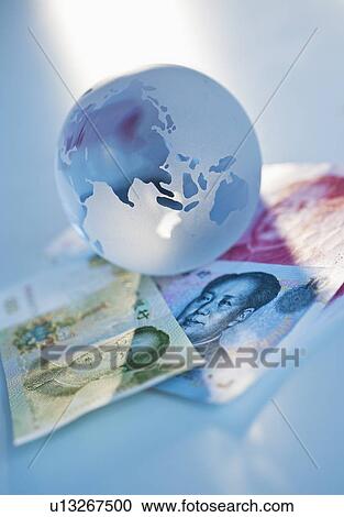 Globe on Chinese currency View Large Photo Image Stock Image - Globe on Chinese currency. Fotosearch
