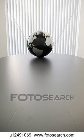 Globe on conference room table View Large Photo Image Stock Photo - Globe on conference room table. Fotosearch