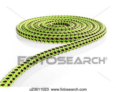 Stock Image - Green and black rope in a circular pattern. Fotosearch