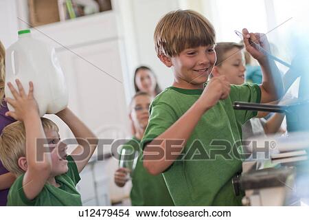 Picture - Group of children in kitchen. Fotosearch