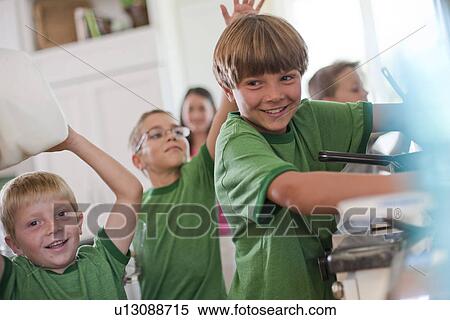 Stock Photography - Group of children in kitchen. Fotosearch