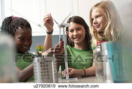 Stock Photo - Group of children looking at model windmill. Fotosearch