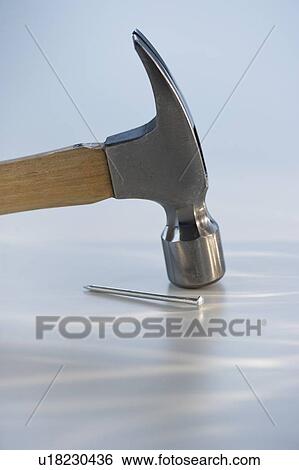 Hammer and nail View Large Photo Image Stock Photograph - Hammer and nail. Fotosearch