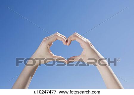 Stock Photo - Hands forming a heart shape. Fotosearch