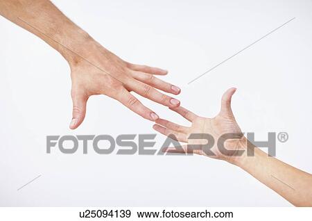 Stock Photo - Hands reaching. Fotosearch