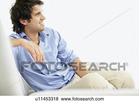 Stock Photo - Handsome man daydreaming. Fotosearch