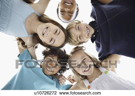 Happy children huddled together View Large Photo Image Stock Image - Happy children huddled together. Fotosearch