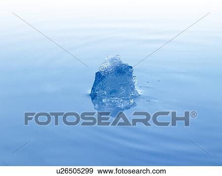 Stock Photo - Ice cube in water. Fotosearch