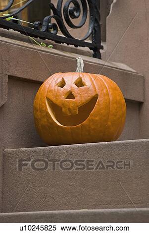 Stock Photography - Jack-o-lantern on step. Fotosearch