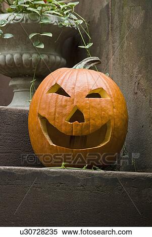 Stock Photography - Jack-o-lantern on step. Fotosearch