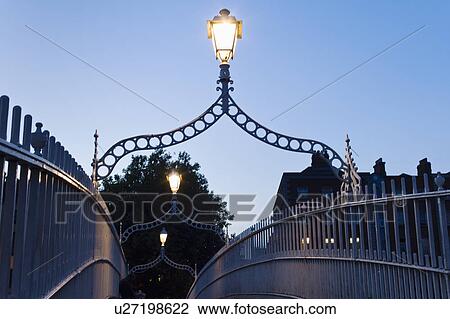Stock Image - Lights on Ha'penny bridge in Dublin Ireland. Fotosearch