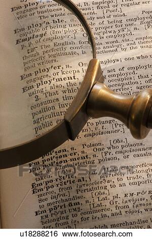 Stock Photograph - Magnifying glass over dictionary. Fotosearch