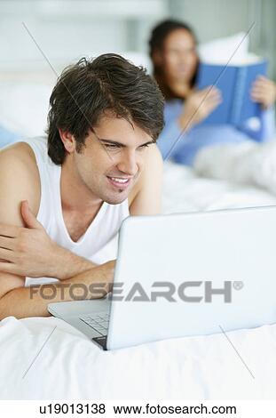 Man browsing the internet View Large Photo Image Stock Photo - Man browsing the internet. Fotosearch