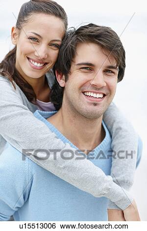 Man giving woman a piggy back ride View Large Photo Image Stock Photograph - Man giving woman a piggy back ride. Fotosearch