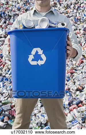 Man holding blue bin View Large Photo Image Stock Image - Man holding blue bin. Fotosearch