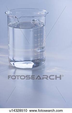 Measuring cup full of water View Large Photo Image Stock Image - Measuring cup full of water. Fotosearch
