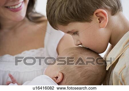 Stock Image - Mother and her two children. Fotosearch