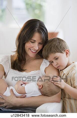 Stock Photo - Mother and her two children. Fotosearch