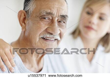 Nurse caring for senior patient View Large Photo Image Stock Image - Nurse caring for senior patient. Fotosearch