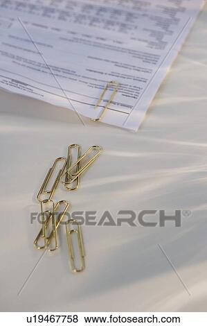 Paper clips and document View Large Photo Image Stock Photo - Paper clips and document. Fotosearch