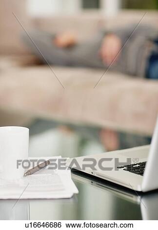 Stock Photograph - Paperwork and laptop on desk. Fotosearch