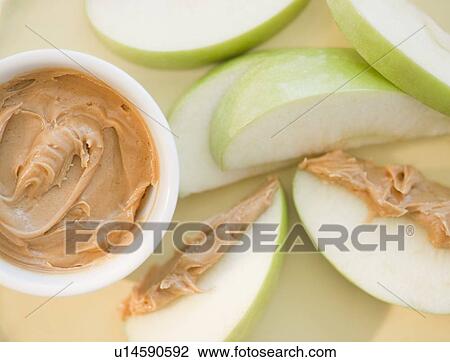 Peanut butter on sliced apple View Large Photo Image Stock Image - Peanut butter on sliced apple. Fotosearch