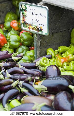 Stock Image - Peppers on display at farmer's market. Fotosearch