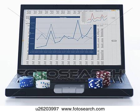 Poker chips on laptop View Large Photo Image Stock Photo - Poker chips on laptop. Fotosearch