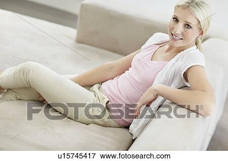 Pretty blond woman relaxing View Large Photo Image Stock Photo - Pretty blond woman relaxing. Fotosearch