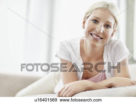 Pretty blond woman relaxing View Large Photo Image Stock Photo - Pretty blond woman relaxing. Fotosearch