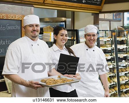 Proud bakery workers View Large Photo Image Stock Image - Proud bakery workers. Fotosearch
