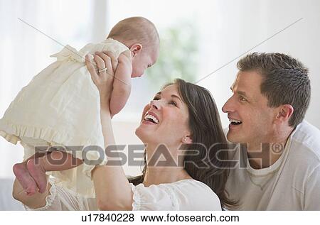 Proud parents and their baby daughter View Large Photo Image Stock Photo - Proud parents and their baby daughter. Fotosearch