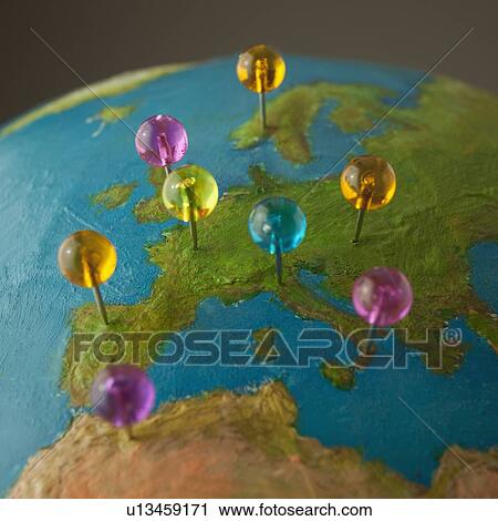 Push pins on globe View Large Photo Image Stock Image - Push pins on globe. Fotosearch