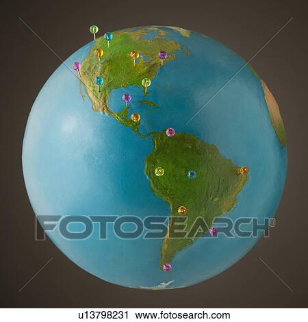 Push pins on globe View Large Photo Image Stock Image - Push pins on globe. Fotosearch