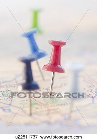 Stock Photo - Pushpins in a map. Fotosearch