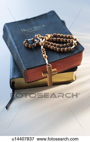 Rosary on bible View Large Photo Image Stock Photo - Rosary on bible. Fotosearch