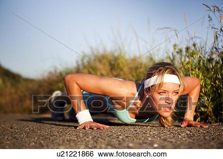 Stock Photograph - Runner doing push ups. Fotosearch
