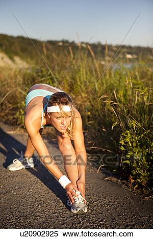 Stock Photography - Runner stretching. Fotosearch